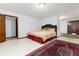 Basement bedroom with a floral bedspread and area rug at 7846 Village Rd, Parker, CO 80134