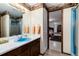 Basement bathroom with a blue sink and shower at 7846 Village Rd, Parker, CO 80134