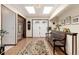 Bright entryway with tile floors, a built-in bench, and skylights at 7846 Village Rd, Parker, CO 80134