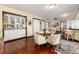 Breakfast nook with a round table and chairs, adjacent to kitchen and bar at 7846 Village Rd, Parker, CO 80134