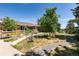 Landscaped front yard of brick ranch home at 7846 Village Rd, Parker, CO 80134