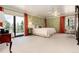 Large bedroom with scenic views, ample closet space and sitting area at 7846 Village Rd, Parker, CO 80134