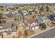 Aerial view of a house in a residential area near a golf course at 325 Crosshaven Pl, Castle Rock, CO 80104