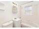 Clean bathroom with tub, single sink vanity, and medicine cabinet at 1565 Xanthia St, Denver, CO 80220