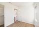 Bedroom with neutral carpeting and access to a closet and hallway at 1565 Xanthia St, Denver, CO 80220