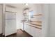 White kitchen with gas range and refrigerator at 1565 Xanthia St, Denver, CO 80220