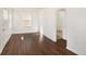 Bright living room featuring hardwood floors and an arched doorway at 1565 Xanthia St, Denver, CO 80220