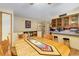 Spacious dining area with a wooden table and chairs, adjacent to kitchen at 6960 E County Line Road 1, Longmont, CO 80504