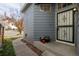 Side view of the house, showing a side entrance and landscaping at 6253 Xavier St, Arvada, CO 80003