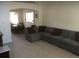 Open living room featuring a sectional sofa and adjacent dining area at 13674 Plaster Cir, Broomfield, CO 80023
