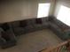 High-angle view of a large sectional sofa in the living room at 13674 Plaster Cir, Broomfield, CO 80023