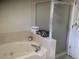 Bathroom with jetted tub and glass enclosed shower at 13674 Plaster Cir, Broomfield, CO 80023