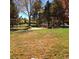 Playground with swings and play structures, surrounded by autumn trees at 13674 Plaster Cir, Broomfield, CO 80023
