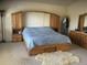 Spacious bedroom with built-in wooden headboard and storage at 13674 Plaster Cir, Broomfield, CO 80023
