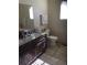 Bathroom with double vanity, granite countertops, and tiled floor at 13674 Plaster Cir, Broomfield, CO 80023