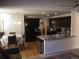 Open kitchen with granite island and dark wood cabinets at 13674 Plaster Cir, Broomfield, CO 80023