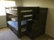 bedroom with built-in bunk beds and drawers at 13674 Plaster Cir, Broomfield, CO 80023