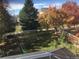 Spacious backyard with trees, grass, and a basketball hoop at 13674 Plaster Cir, Broomfield, CO 80023