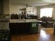 Modern kitchen with granite countertops and dark cabinetry at 13674 Plaster Cir, Broomfield, CO 80023