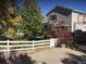 Backyard view of house, trampoline, and partial fence at 13674 Plaster Cir, Broomfield, CO 80023