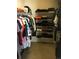 Walk-in closet with hanging rods and shelves for storage at 13674 Plaster Cir, Broomfield, CO 80023