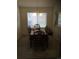 Bright dining room with wooden table and six chairs at 13674 Plaster Cir, Broomfield, CO 80023