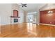 Spacious living room featuring hardwood floors and a fireplace at 1011 S Valentia St # 136, Denver, CO 80247