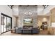 Spacious living room with stone fireplace and large windows at 8006 Trinity Peak Ln, Castle Rock, CO 80108