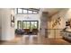 Open concept living room with stone fireplace and high ceilings at 8006 Trinity Peak Ln, Castle Rock, CO 80108