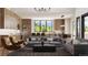 Open floor plan boasts a spacious living area and kitchen with mountain views at 8006 Trinity Peak Ln, Castle Rock, CO 80108