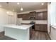 Modern kitchen with light countertops, stainless steel appliances, and wood cabinets at 15898 Little Bluestem Rd, Monument, CO 80132