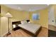 Basement bedroom with wood-look floors and window at 6145 S Paris St, Greenwood Village, CO 80111