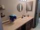 Bathroom with vanity, sink, and shower at 3550 S Harlan St # 313, Denver, CO 80235