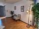 Light and airy entryway with wood floors and seating area at 3550 S Harlan St # 313, Denver, CO 80235