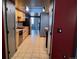 Kitchen with light wood cabinets and a double sink at 3550 S Harlan St # 313, Denver, CO 80235