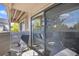 Private balcony with seating for two and sliding glass doors at 9510 E Florida Ave # 2052, Denver, CO 80247