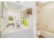 Well-maintained bathroom featuring a shower/tub combo and updated fixtures at 9510 E Florida Ave # 2052, Denver, CO 80247