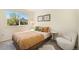 Cozy bedroom featuring a neutral color palette and a view of trees at 9510 E Florida Ave # 2052, Denver, CO 80247