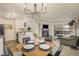 Bright dining area with a mid-century modern table and four chairs at 9510 E Florida Ave # 2052, Denver, CO 80247