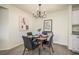 Dining area with four chairs and a modern chandelier at 9510 E Florida Ave # 2052, Denver, CO 80247