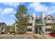 Exterior view of a two-story condo building with a staircase at 9510 E Florida Ave # 2052, Denver, CO 80247