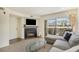 Living room with sectional sofa, coffee table, and fireplace at 9510 E Florida Ave # 2052, Denver, CO 80247