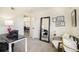 Bright home office with a desk, chair and view of dining area at 9510 E Florida Ave # 2052, Denver, CO 80247