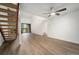 Living area with wood staircase and access to balcony at 326 Wright St # 304, Lakewood, CO 80228