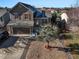 Two-story house, landscaping, and driveway; view of surrounding area at 341 N 18Th Ct, Brighton, CO 80601