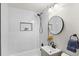 Clean bathroom with a shower/tub combo and modern vanity at 450 S Decatur St, Denver, CO 80219