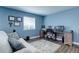 Home office with desk and chair, light blue walls at 25626 E Bayaud Ave, Aurora, CO 80018