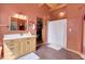 Bathroom with a large vanity and a walk-in shower at 26526 Gray Buck Trl, Conifer, CO 80433