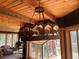 Rustic chandelier with horses, adding a unique touch at 26526 Gray Buck Trl, Conifer, CO 80433