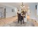 Spacious dining room with hardwood floors and view into kitchen at 1658 S Milwaukee St, Denver, CO 80210